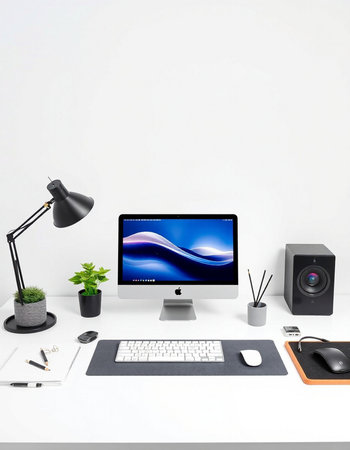 workplace with computer, lamp, mouse, speaker and plant on white background