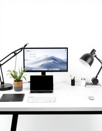 Modern desktop with computer, laptop and other office supplies on white backgroundの写真素材