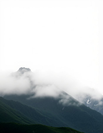 Mountain landscape with clouds and fog. Caucasus Mountains, Georgia.