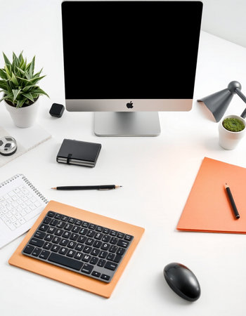 Modern workspace with computer, supplies and copy space on white table. Flat lay, top viewの写真素材