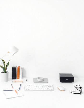 Minimal workspace with computer, stationery and copy space on white wall background