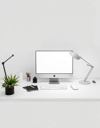 Computer with blank screen on white table. Workplace concept.