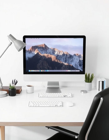 Modern desktop with computer, lamp and other items. 3d rendering.の写真素材