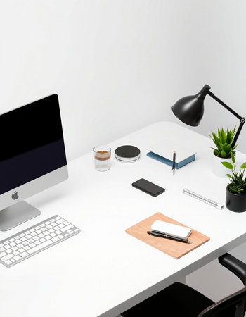 workplace with computer, stationery and coffee cup on white tableの写真素材