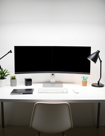 Modern workspace with computer monitor, keyboard, mouse, coffee cup and other itemsの写真素材