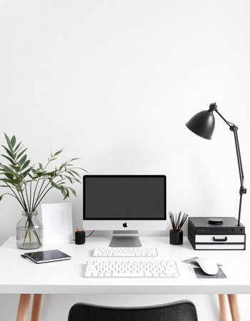 Modern workspace with computer, stationery and copy space on white wall