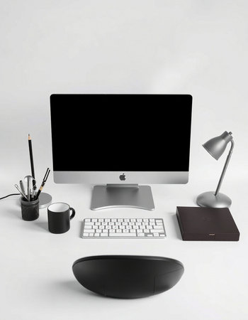 Computer screen, keyboard, mouse, lamp, pencil and stationery
