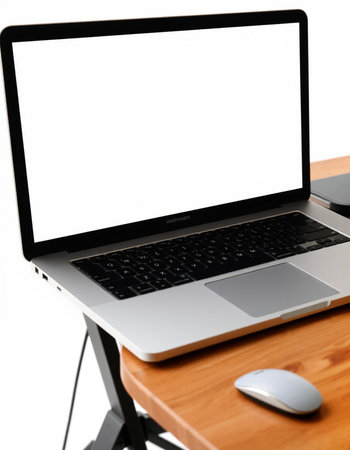 Laptop computer with blank screen on wooden desk isolated on white background