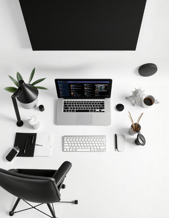 Modern workplace with laptop, stationery and coffee cup on white backgroundの写真素材