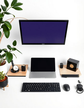 Modern workspace with computer, keyboard, mouse, plant and accessories on white background