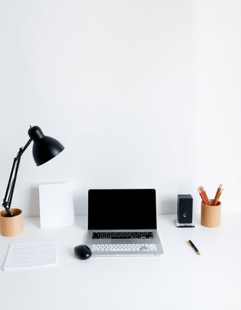 workplace with laptop, stationery and coffee cup on white backgroundの写真素材
