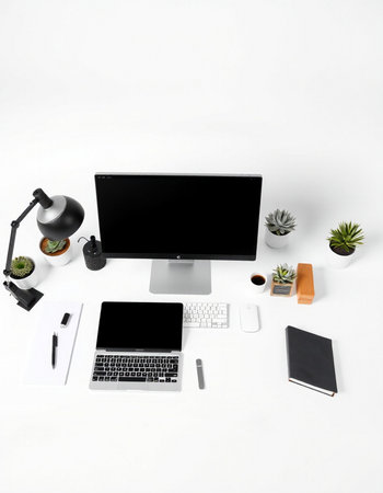 Top view of modern workplace with computer, supplies and coffee cup on white backgroundの写真素材