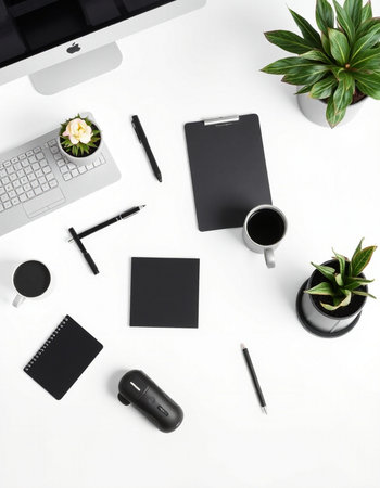 Flat lay, top view office desk. Work space with computer, supplies, coffee cup, notebook, pen and...