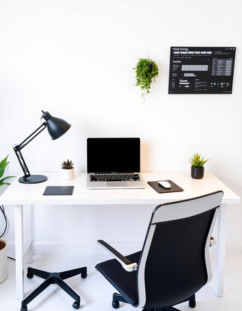 Modern workplace with laptop, smartphone, coffee cup and computer on tableの写真素材