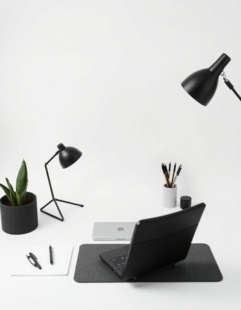 Modern workspace with laptop, stationery and copy space on white background