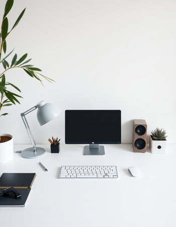 Minimal workspace with computer, keyboard, coffee cup and other items on white background
