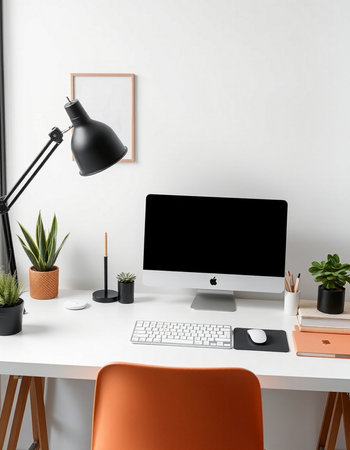 Workplace with computer, lamp and stationery on table