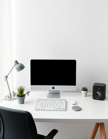 Workplace with modern computer, mouse, keyboard, lamp and plant