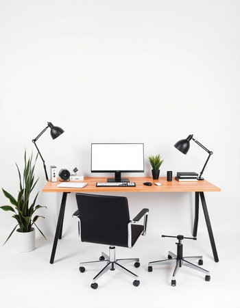 Modern workplace with computer, lamp and other objects on white wall backgroundの写真素材
