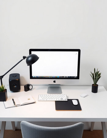workplace with computer, keyboard, mouse, lamp and stationery