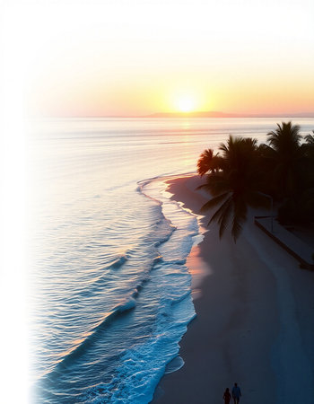 Beautiful sunset on the beach with palm trees and sea waves.の写真素材
