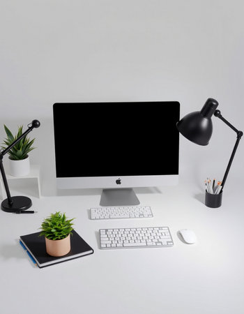 Workplace with computer, mouse, keyboard, lamp and plant on white background