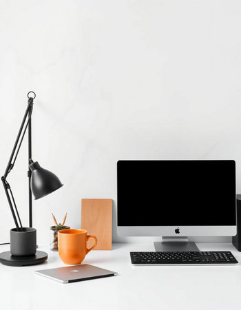 Modern workspace with computer, supplies and coffee cup on white table. Workplace conceptの写真素材