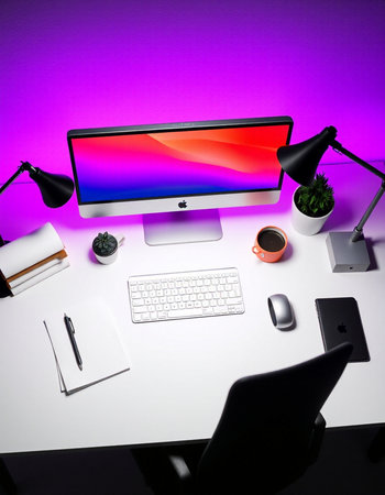 Workplace with computer, coffee and stationery on a purple backgroundの写真素材