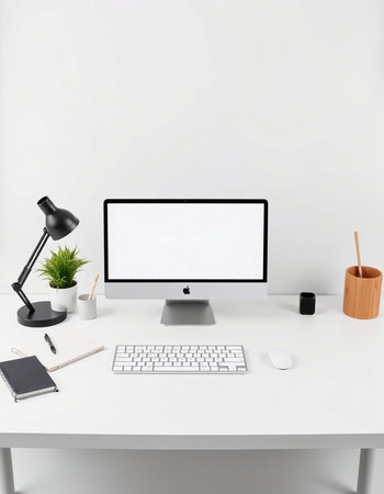 Modern workplace with blank screen computer, stationery and accessories on table