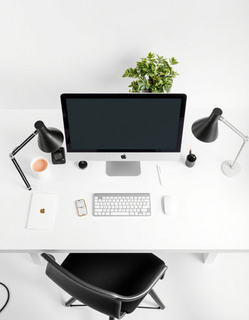Workplace with computer and stationery on white table, top view