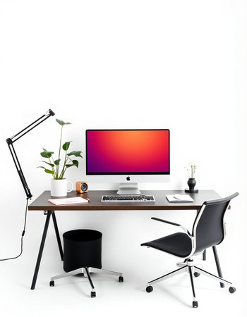 Modern workplace with computer, lamp, plant and coffee cup on white backgroundの写真素材