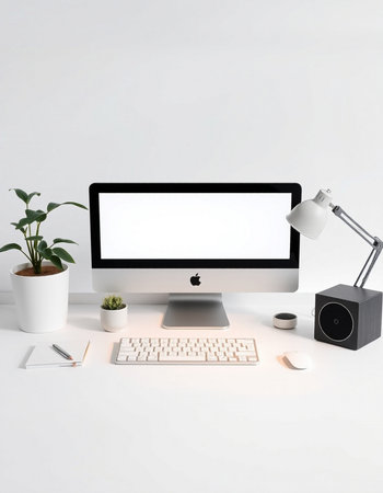 Computer with blank screen, keyboard, mouse, lamp and plant on white background