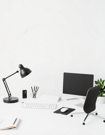 Minimalistic workplace with blank screen computer, supplies and copy space on white wall background