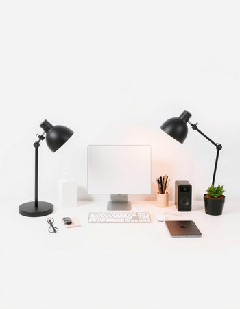 workplace with computer, keyboard, mouse, lamp and other objects on white backgroundの写真素材