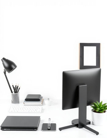 Modern workspace with computer, supplies and coffee cup on white background.