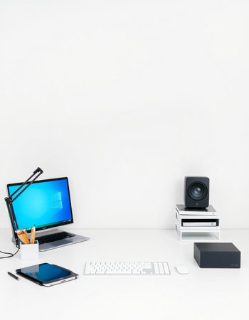 Office desk with computer, laptop, tablet and other equipment on white background