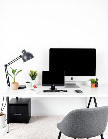Modern workspace with computer, lamp and decorations.