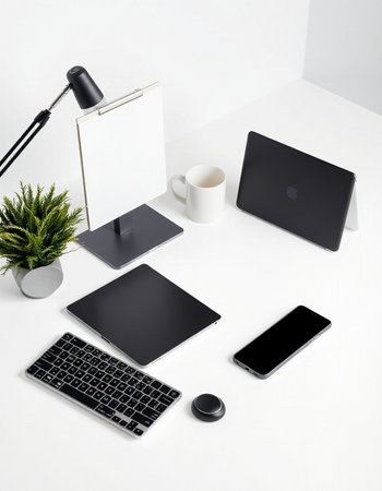 Modern workspace with laptop, tablet, smartphone and coffee cup. Flat lay, top viewの写真素材
