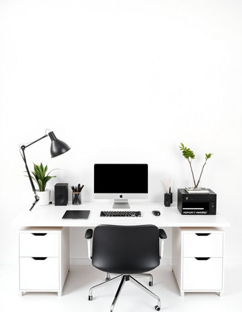 Modern workplace with computer, stationery and plant on white wall background