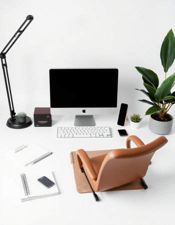 Modern workspace with computer, stationery and plants on white background. Flat lay, top viewの写真素材