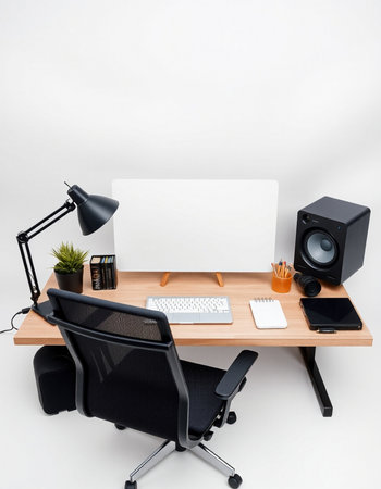 Office desk with computer, chair, lamp and speakers isolated on white