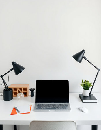 Workplace with blank laptop, stationery and decorations on white tableの写真素材