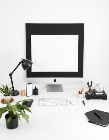 Workplace with computer, stationery and plant on white wall background