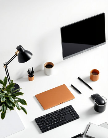 Top view of modern workplace with laptop, coffee cup, stationery and other items. Mock upの写真素材