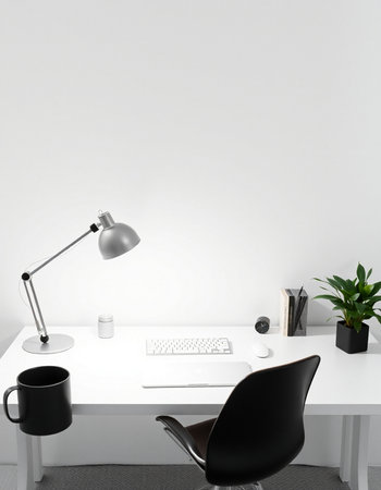Modern office interior with a white wall, a computer and a black chair
