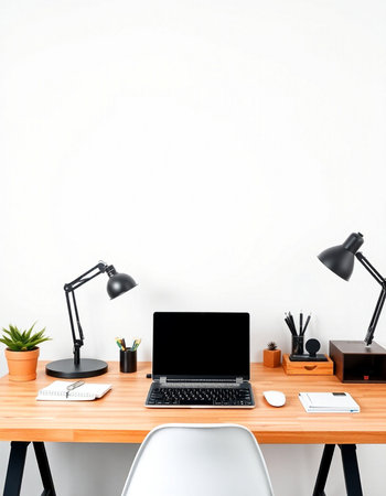 Modern workplace with blank screen laptop on wooden table and white wall backgroundの写真素材