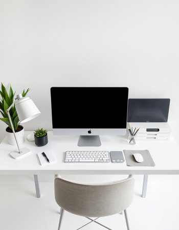 workplace with computer, keyboard, mouse, coffee cup and plant