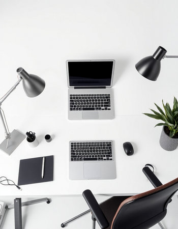 Top view of modern workplace with laptop, stationery and decorations on white background
