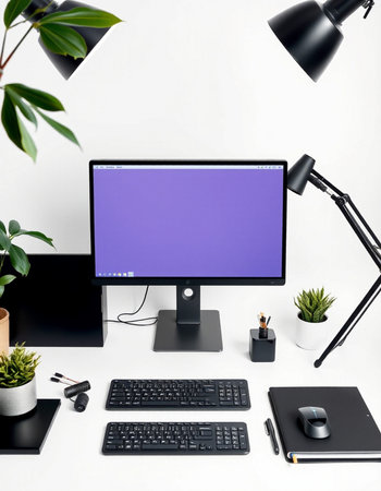 Modern workspace with computer monitor, keyboard, mouse, stationery and plants on white background