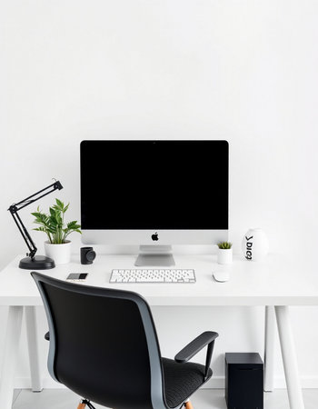 Modern workspace with computer, keyboard, mouse and plant on white tableの写真素材